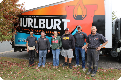 Hurlburt crew with customers in front of company truck