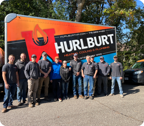 Hurlburt team posing in front of company van